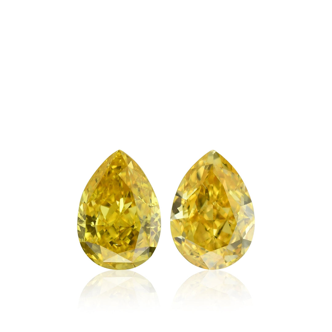0.64 Carat Fancy Vivid Orangy Yellow Pear Diamonds SI1