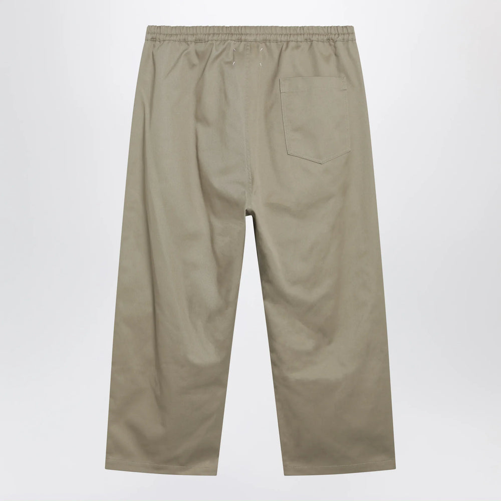 Maison Margiela - Low-crotch cotton gabardine trousers in beige Brand Apparel & Accessories > Clothing > Pants